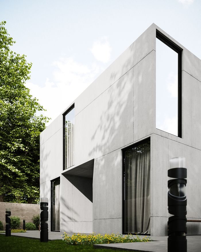 Sleek modern concrete house with large glass windows and surrounding lawn.