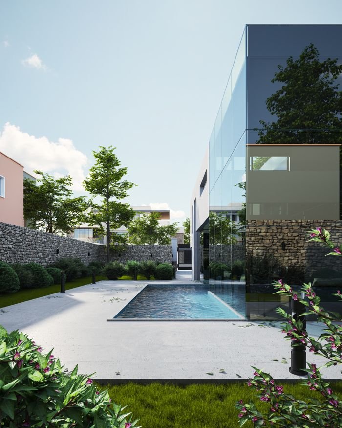 Elegant modern house with glass exterior and pool surrounded by lush greenery, under a clear sky.